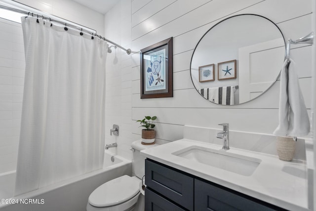 full bathroom with shower / bathtub combination with curtain, toilet, and vanity with extensive cabinet space