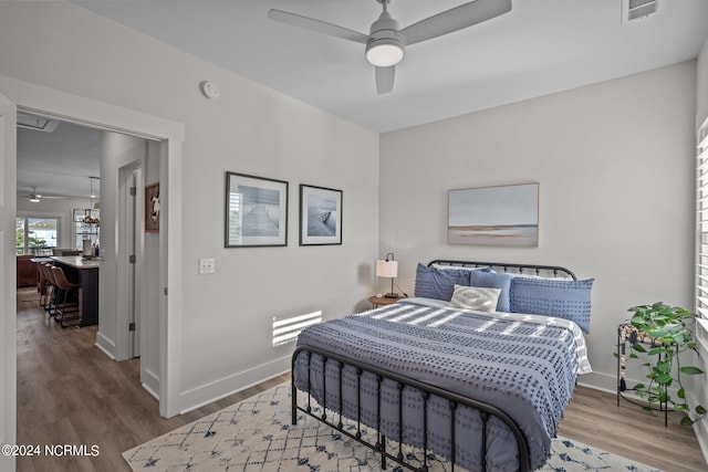 bedroom featuring hardwood / wood-style floors and ceiling fan