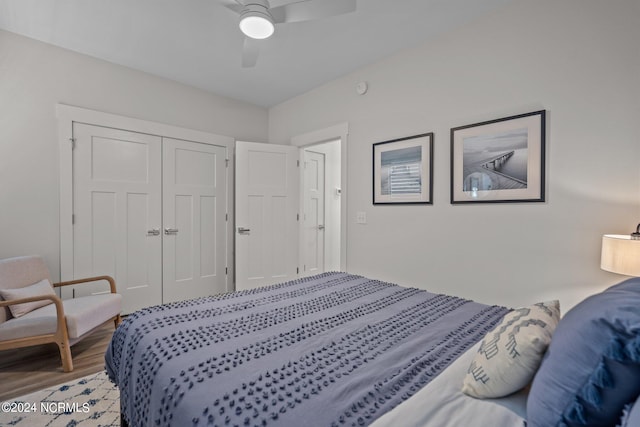 bedroom featuring light hardwood / wood-style flooring, ceiling fan, and a closet