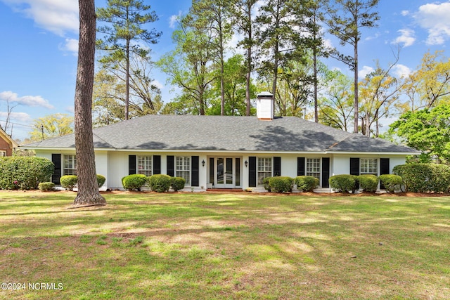 ranch-style house with a front lawn