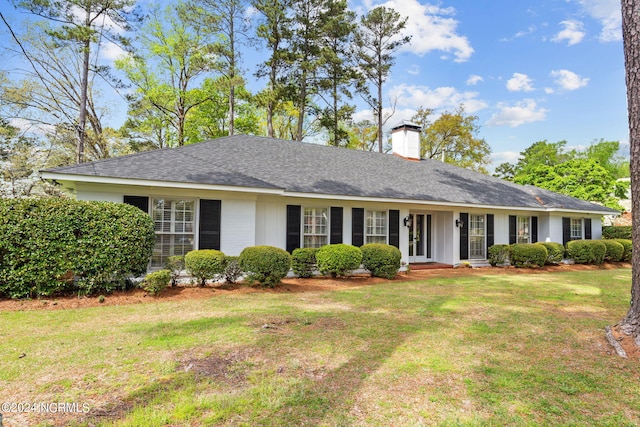 ranch-style home with a front yard