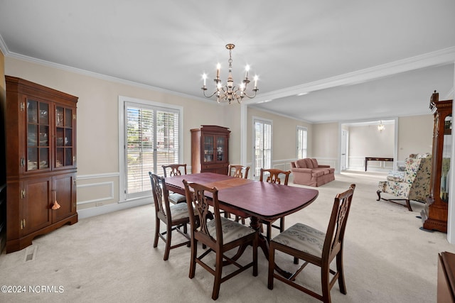 carpeted dining room featuring crown molding and an inviting chandelier