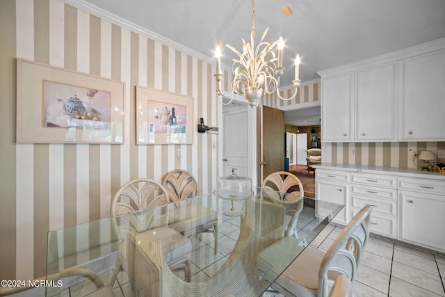 dining space with light tile flooring, ornamental molding, and a notable chandelier