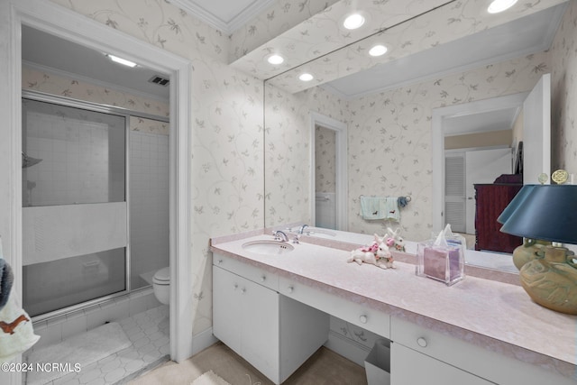 bathroom with toilet, tile flooring, a shower with shower door, and vanity