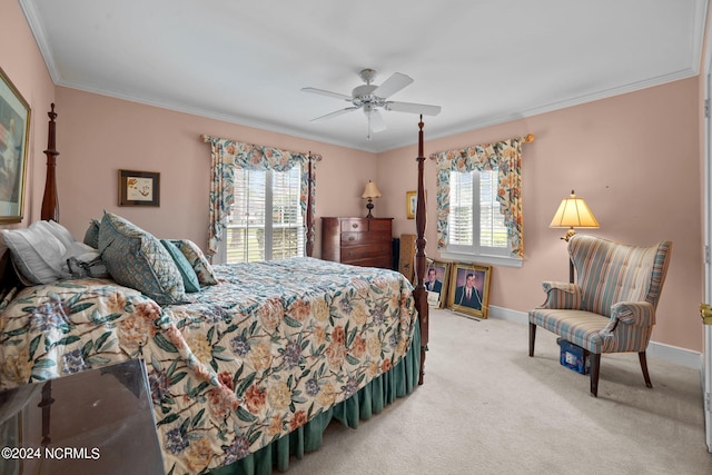 carpeted bedroom featuring ceiling fan and ornamental molding