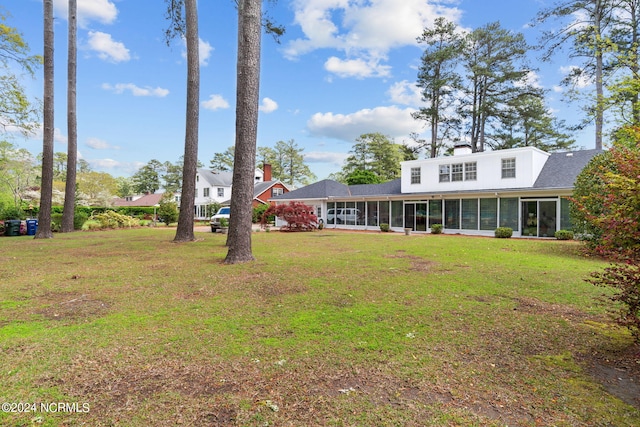 view of yard featuring a sunroom