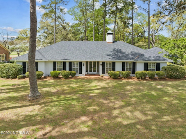 single story home with a front yard