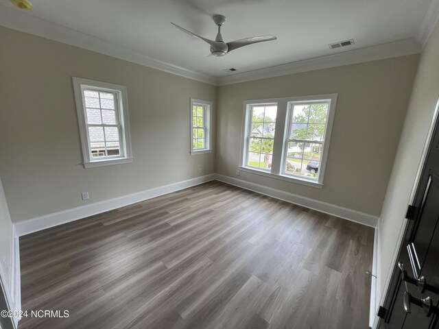 unfurnished room with ceiling fan, crown molding, and wood-type flooring