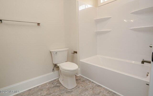 bathroom with toilet and tile patterned floors