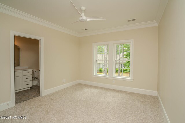 unfurnished bedroom featuring ceiling fan, ornamental molding, and light carpet