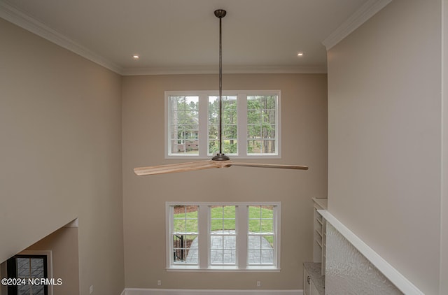 unfurnished living room featuring baseboards, recessed lighting, and crown molding