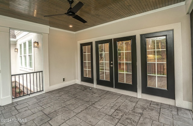 view of patio / terrace featuring ceiling fan and french doors