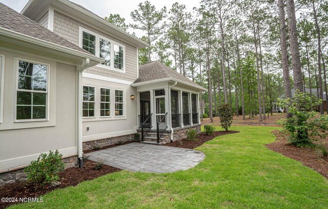 view of yard with a sunroom