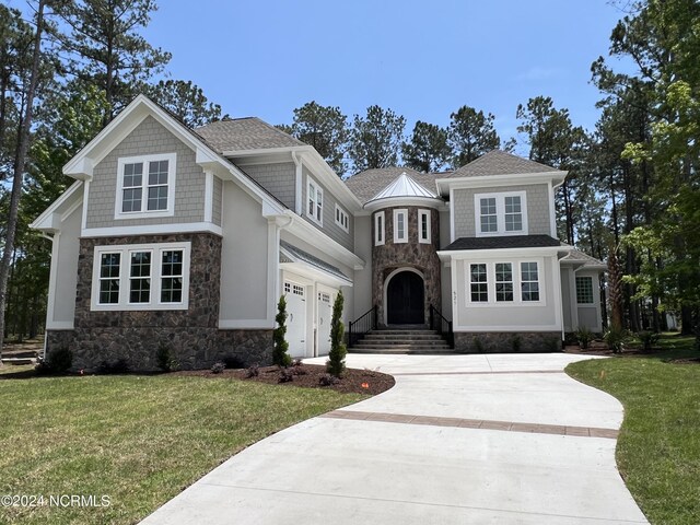 view of front facade with a front lawn and a garage