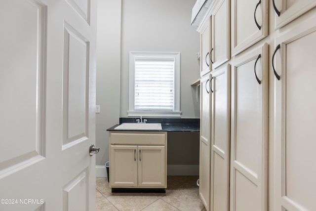 bathroom with vanity and tile flooring