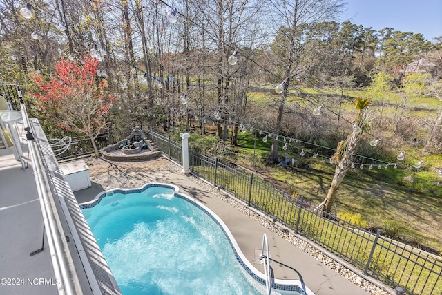 view of pool featuring a patio