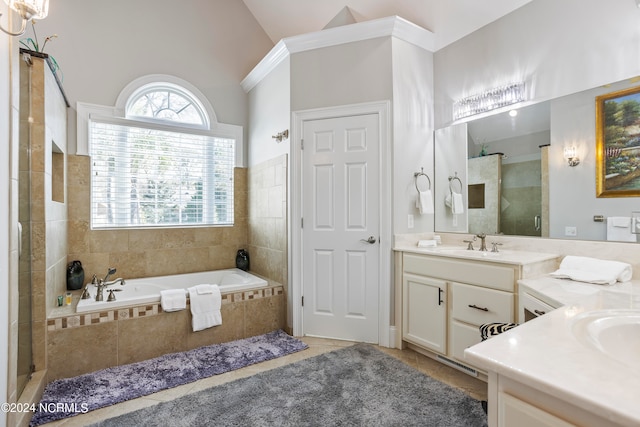 bathroom with tile flooring, separate shower and tub, high vaulted ceiling, and vanity