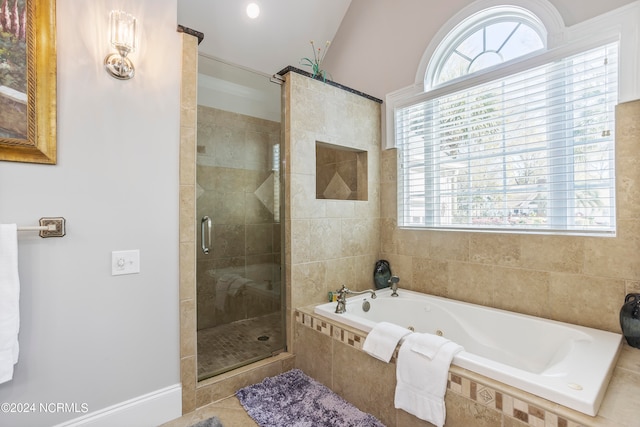 bathroom featuring tile flooring and independent shower and bath