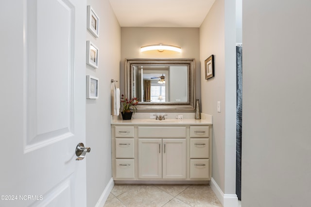 bathroom featuring tile floors and vanity