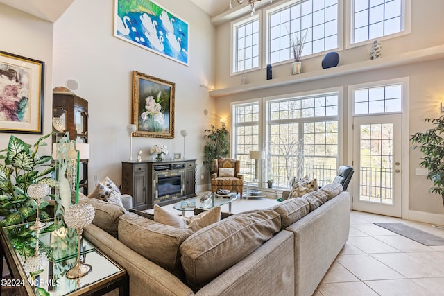 tiled living room featuring a high ceiling