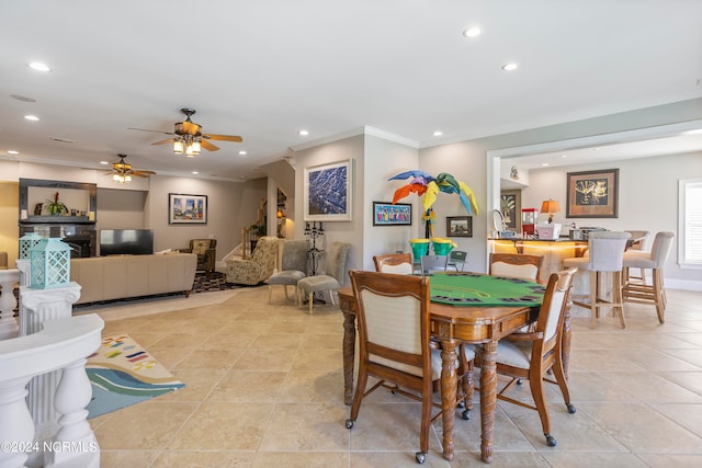 dining area featuring ceiling fan and light tile floors