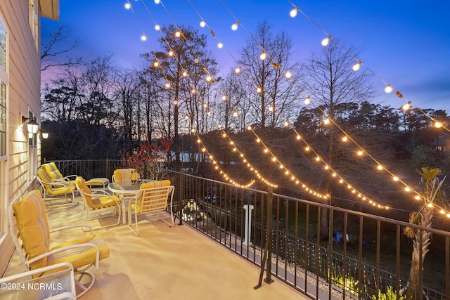 view of patio terrace at dusk