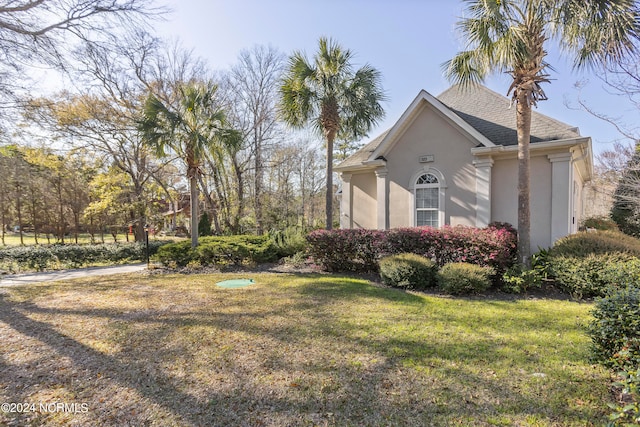 view of home's exterior featuring a yard