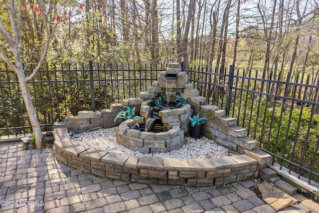 view of terrace with a fire pit