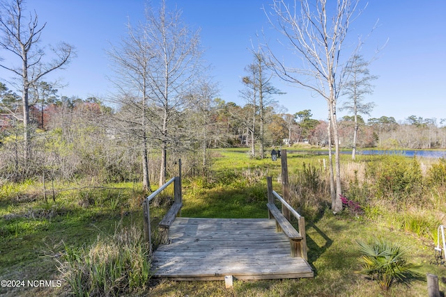 surrounding community with a water view