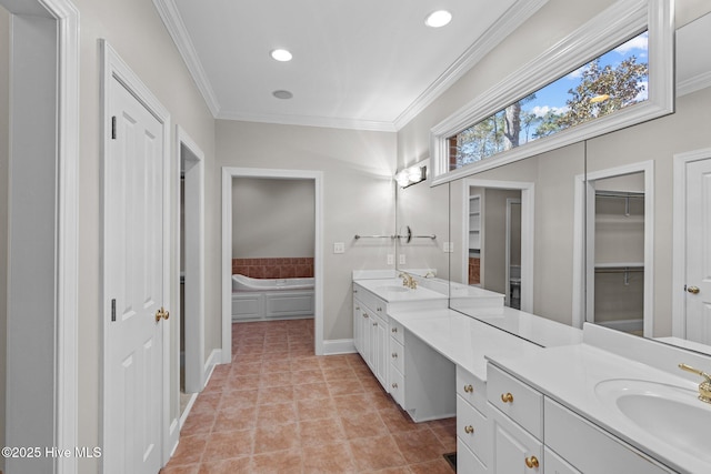 bathroom featuring ornamental molding, vanity, tile patterned flooring, and a bath