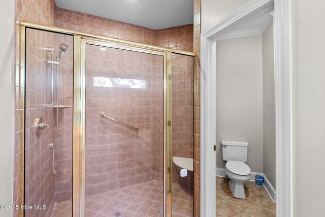 bedroom with connected bathroom, crown molding, a raised ceiling, and light colored carpet