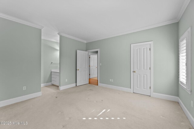 bathroom featuring crown molding, tile floors, and a bath to relax in