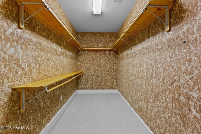 bedroom featuring crown molding and light colored carpet