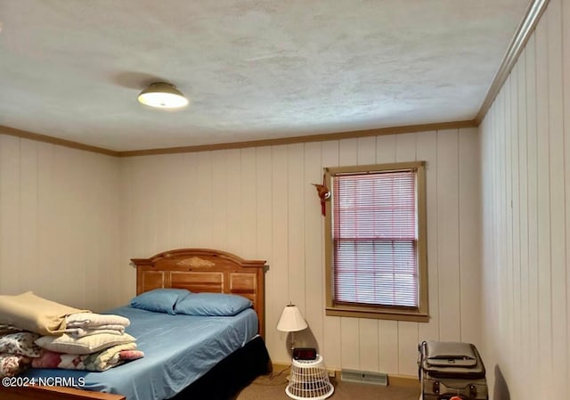 carpeted bedroom featuring ornamental molding