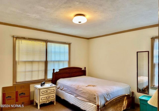 bedroom featuring a textured ceiling and dark carpet