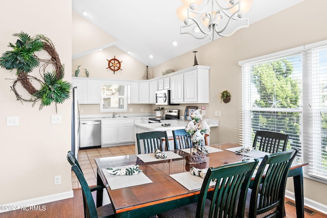 dining room featuring a notable chandelier, recessed lighting, visible vents, high vaulted ceiling, and baseboards