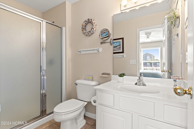 bathroom with a stall shower, tile patterned flooring, toilet, and ensuite bath