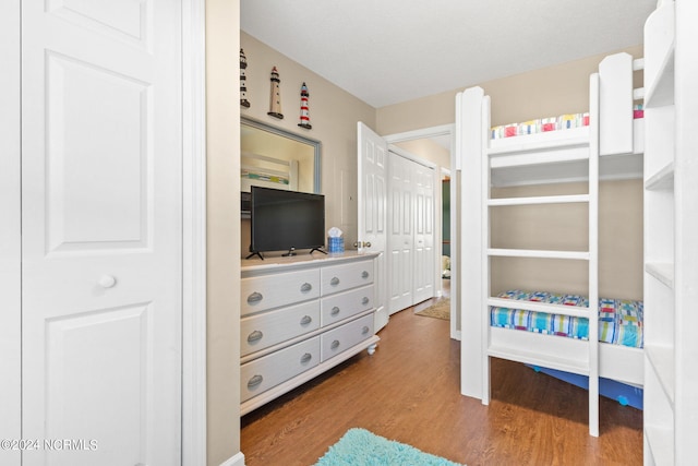 bedroom featuring wood finished floors