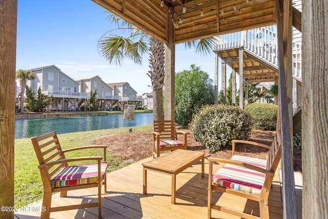 exterior space featuring a water view and a residential view