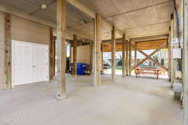 misc room with unfinished concrete flooring