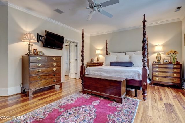 bedroom with ceiling fan, light wood-type flooring, and ornamental molding