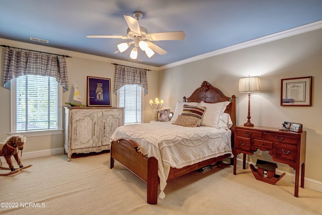 carpeted bedroom with ornamental molding and ceiling fan