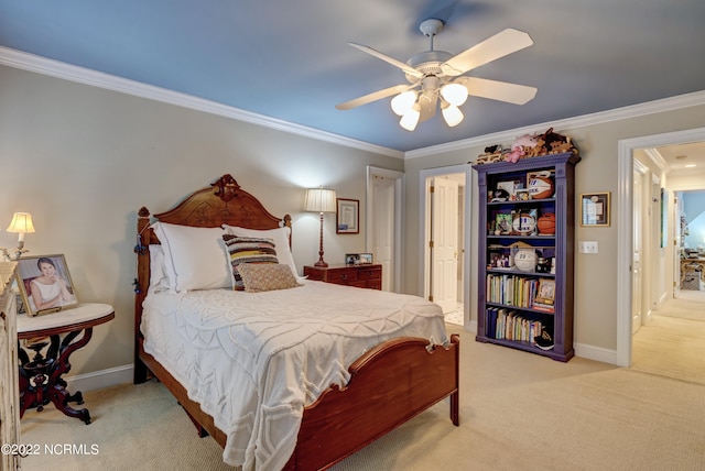 carpeted bedroom featuring ceiling fan and ornamental molding