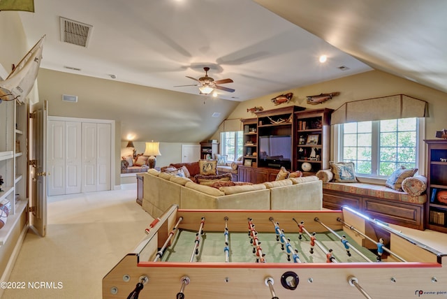 game room with ceiling fan, lofted ceiling, and carpet floors