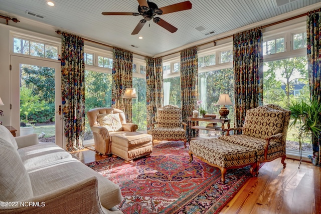 sunroom with a wealth of natural light and ceiling fan