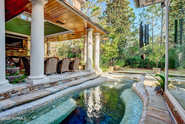 view of swimming pool with a patio area