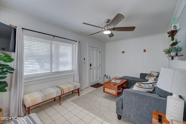 living room featuring ornamental molding, ceiling fan, and light tile floors