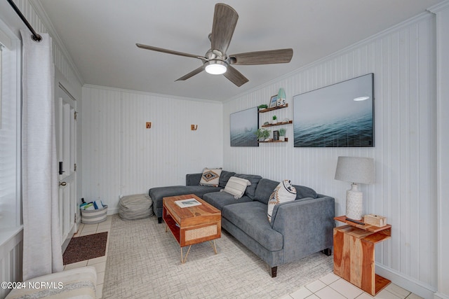 bedroom with wood walls, ornamental molding, and ceiling fan