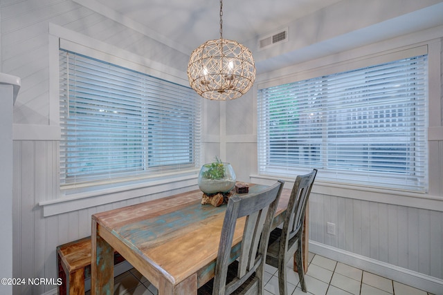 kitchen with light stone countertops, white appliances, light tile flooring, gray cabinets, and sink