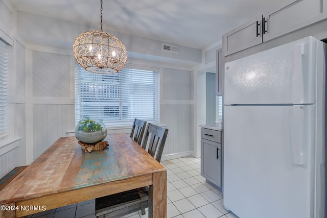 kitchen featuring sink, white appliances, light tile floors, and gray cabinets